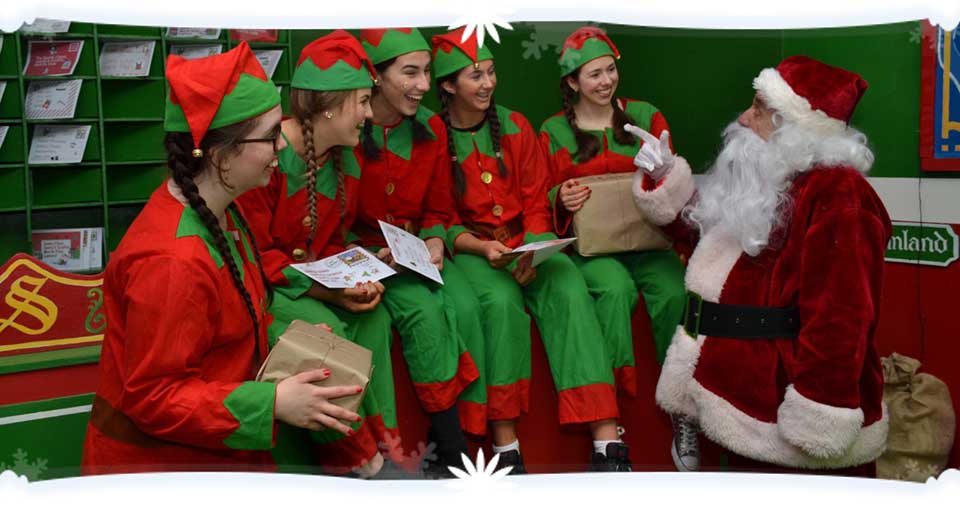 Santa talking to the elves.